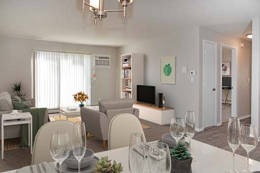 Set Kitchen Table Open to Furnished Living Room with Sliding Glass Door and TV