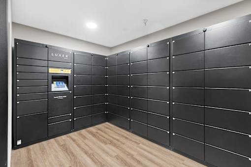 A row of black lockers with a Lexus logo on the top left.