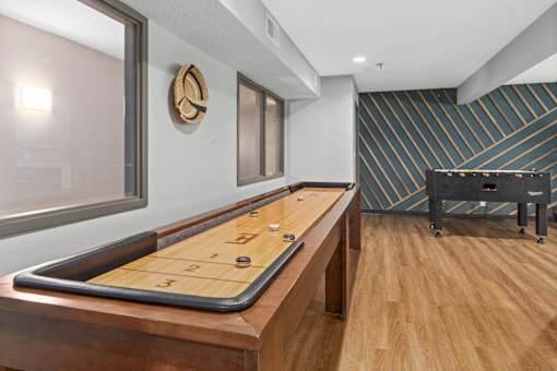 A shiny wood backgammon board with the number 12 on it.