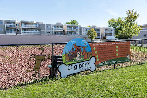 A sign for Dog Park with a dog on it at The Bosk Apartment Homes, Minnesota 55125