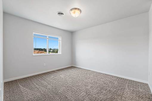 A room with a window and a ceiling light. at Red Rock Apartments, South Dakota 57702