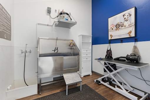 a small room with a sink and a table and a refrigerator at City View St. George Apartments, Utah