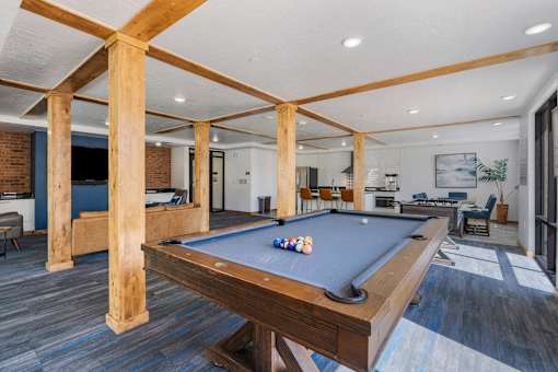 a pool table in the clubhouse of a home with a living room at City View St. George Apartments, St George, UT