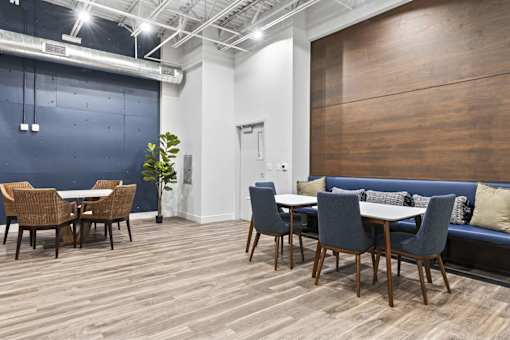 A room with a blue wall and a wooden floor.