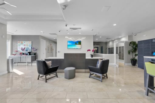 a lobby with a reception desk and chairs