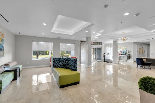 a large living room with a yellow couch and other furniture