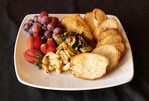 A plate with grapes, strawberries at Bautista Apartments, Tucson, AZ