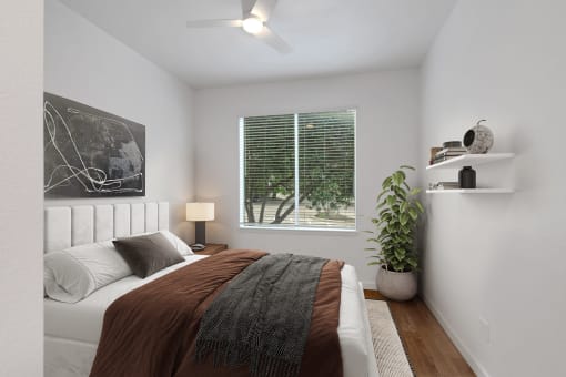 an image of a bedroom with a bed and a window