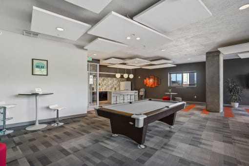 a games room with a pool table and bar at Wilmington Flats Apartments, Salt Lake City