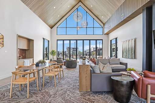 A large room with a lot of furniture and a big window.