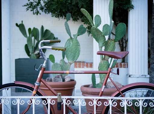 A red bicycle is parked at Bautista Apartments, Tucson, 85745
