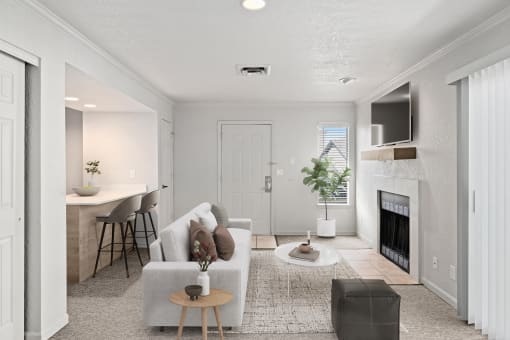 a living room with a couch and a fireplace