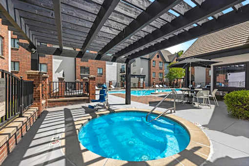 A person is standing by the pool.