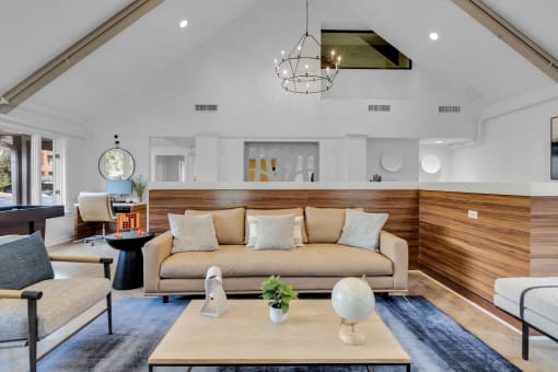 a living room with a couch and a coffee table at AVIA Lofts on Liberty Ridge, Jacksonville, FL, 32256