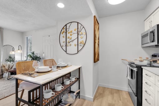 our spacious kitchen and dining room are open to the living room and family room at AVIA Lofts on Liberty Ridge, Florida
