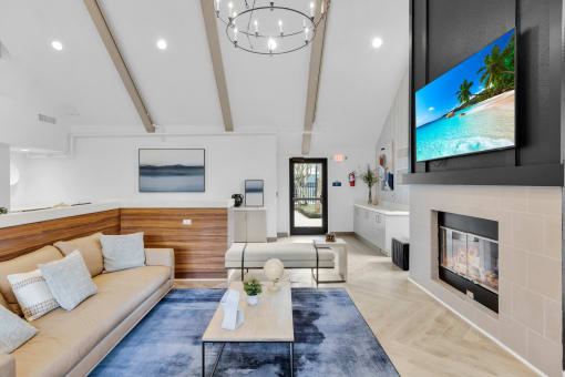 a living room with a couch and a fireplace at AVIA Lofts on Liberty Ridge, Florida