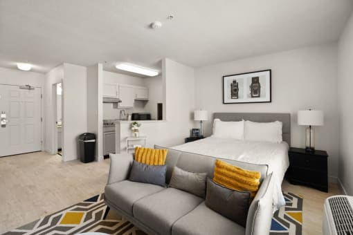 a living room with a couch and a bed