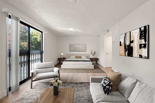 A modern bedroom with a large bed and a couch.