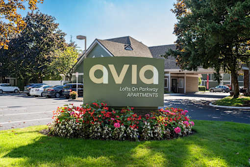 the sign for aviva apartments in front of the building
