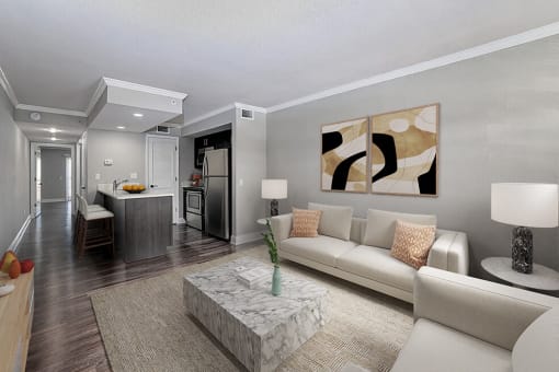 a living room with a white couch and a table
