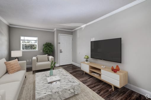 a living room with a couch and a tv