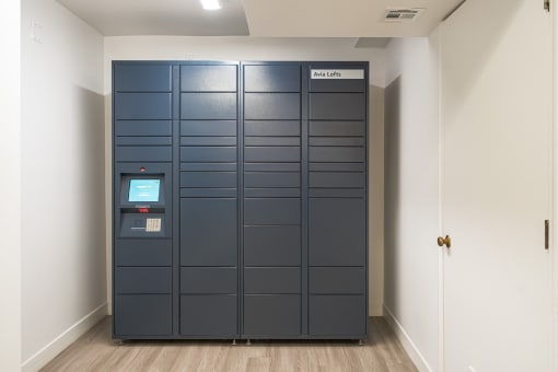 a row of lockers in a room with a door open
