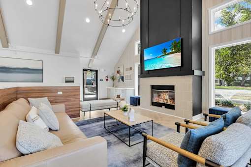 a living room with a couch and a fireplace at AVIA Lofts on Liberty Ridge, Jacksonville, FL, 32256
