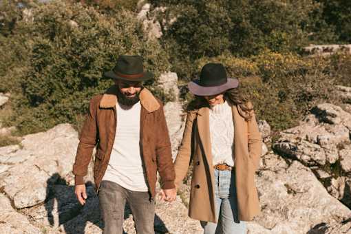 A man and woman are standing on a rocky hillside at Bautista Apartments, Tucson, AZ, 85745