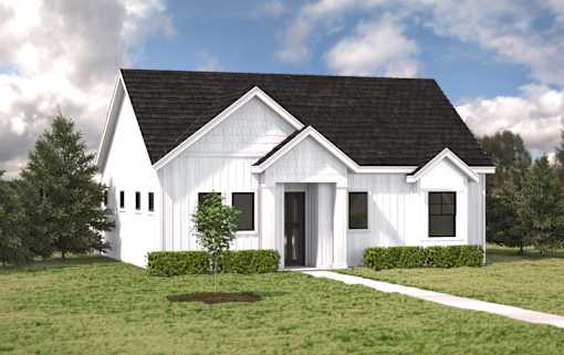 A white barn-style house with a black roof and a small tree in front.at Alante Homes at Spring Run, Caldwell, 83607
