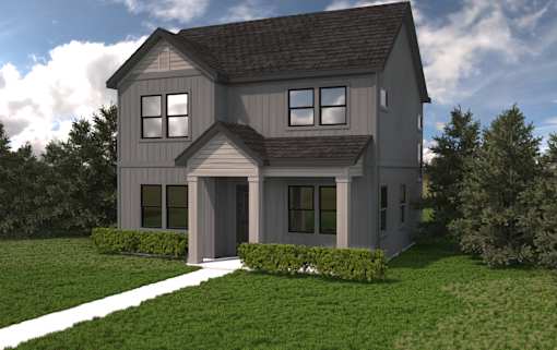 A modern house with a grey exterior and a large front yard.at Alante Homes at Spring Run, Caldwell, ID 83607