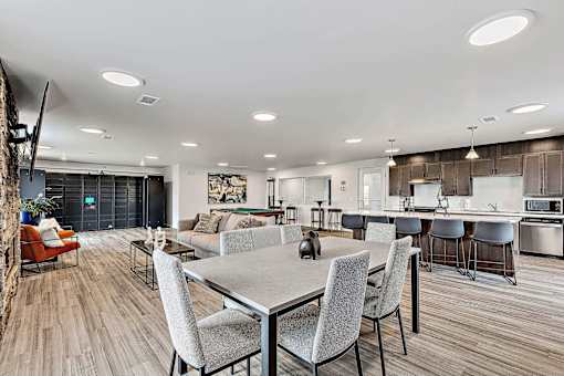 a living room and kitchen area with a dining table and chairs at Red Rock Apartments, South Dakota 57702