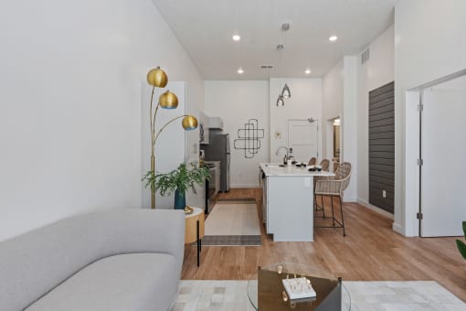a living room and dining room with a couch and a table at SevenO2 Main Apartments, Salt Lake City, 84101