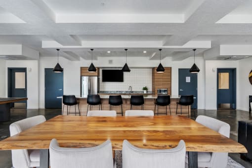 a large dining room with a large table and chairs at The Flats at Riverwoods, Provo, Utah