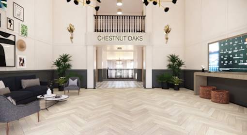 Elegant lobby with modern lighting and reception desk at Chestnut Oaks Apartments, Fort Washington, MD 20744
