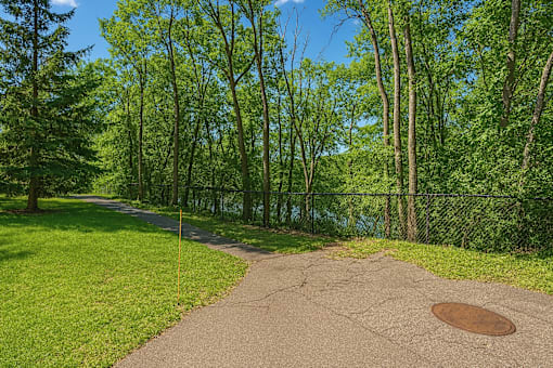 A path in a park with a hole in the middle.
