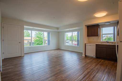 A room with wooden floors and white walls.