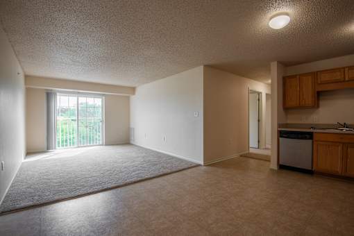 A room with a window and a sink.