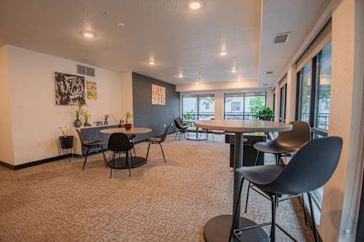 A room with a table and chairs in it.