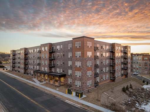 Apartment building with a street in front of it.