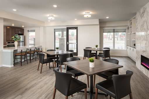 A modern dining room with a large table and chairs.