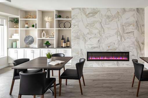 A modern dining room with a table set for four.