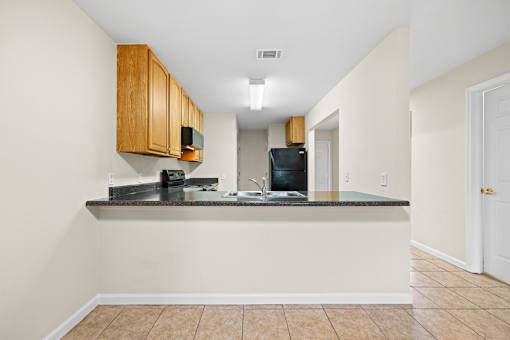 A kitchen with a counter and cabinets.