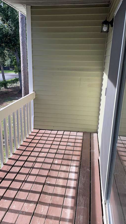 A tiled floor leads to a closed door.