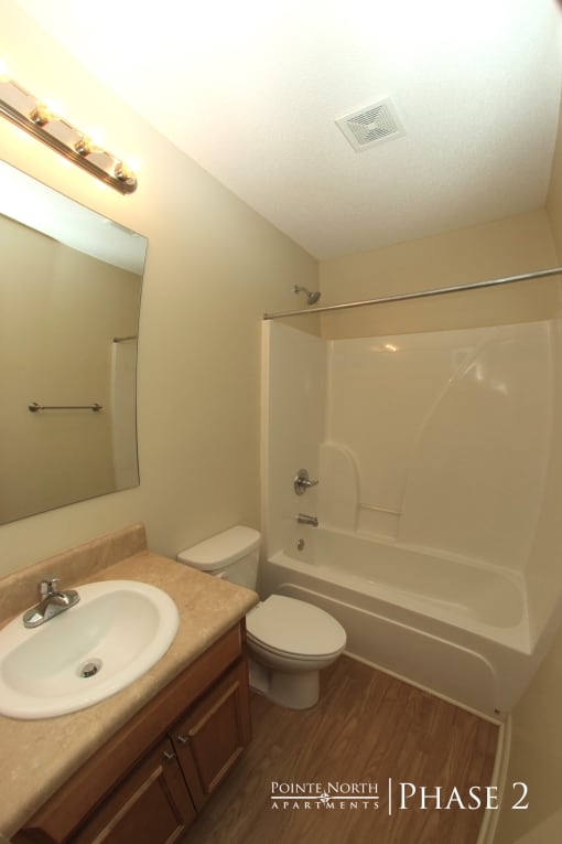 a bathroom with a sink toilet and a shower