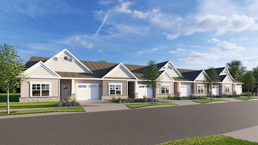 A row of houses with a clear blue sky above them.