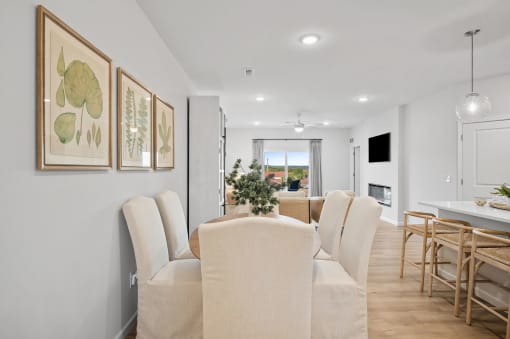 a dining room with a table and chairs
