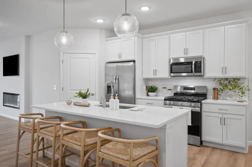 a kitchen with white cabinets and a white counter top