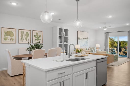 an open concept kitchen and living room with an island and a dining table
