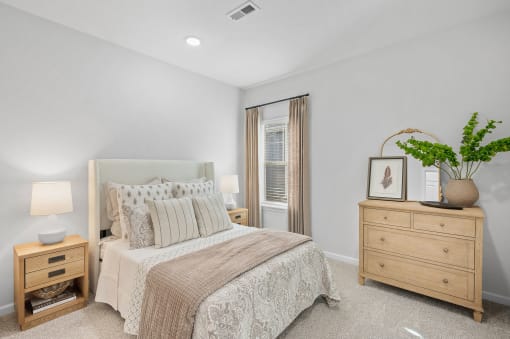 a bedroom with a bed and a dresser