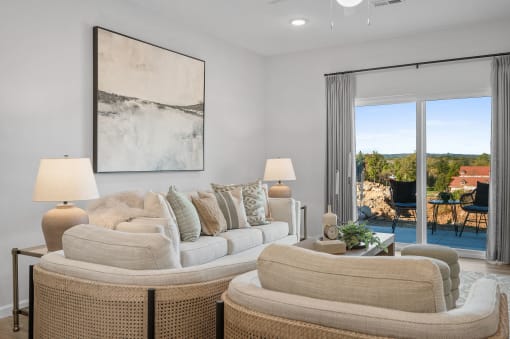a living room with a couch and chairs and a sliding glass door